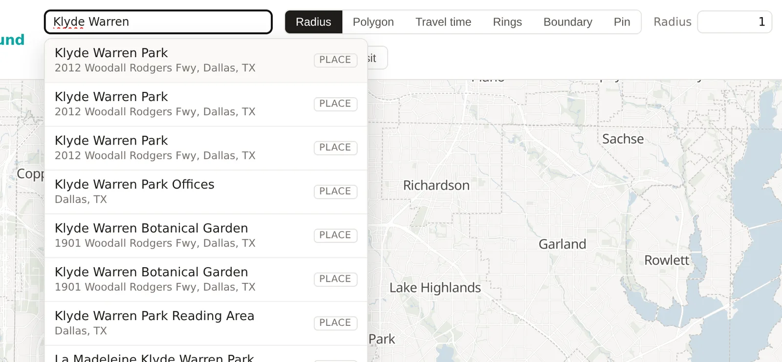The search box with its result list open, showing a city, an address and a business each with its badge